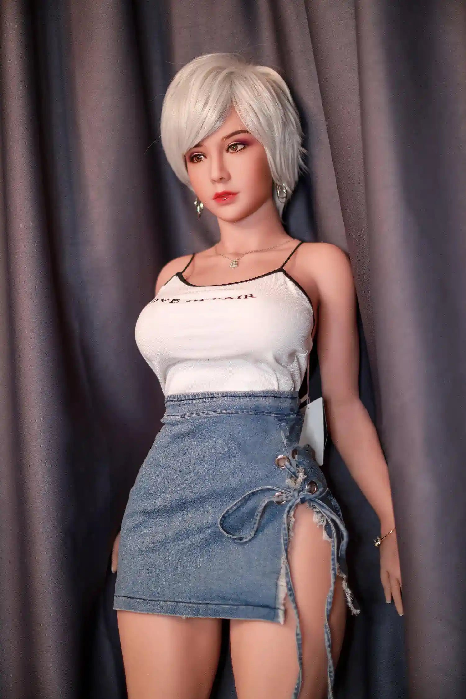 Anahi short platinum blonde hair tan skin white fitted tank denim micro skirt bold Shibuya street style pose, standing in front of the hotel curtain – Asian blonde pornstar sex doll by TopLoveDoll