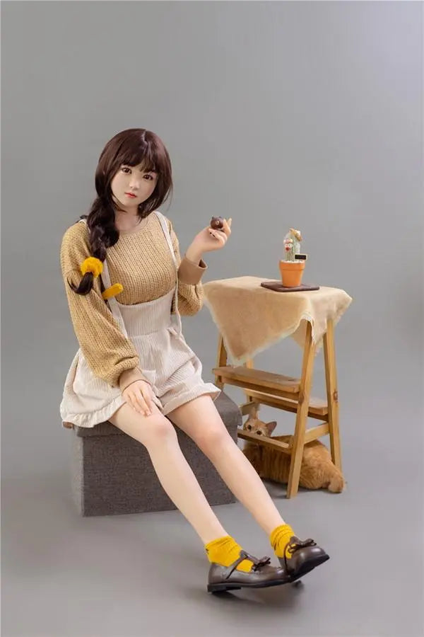 Astrid Asian bangs college sweetheart sex doll, sitting on the storage box chair, stretching her legs causally- first love high school girl next door by TopLoveDoll