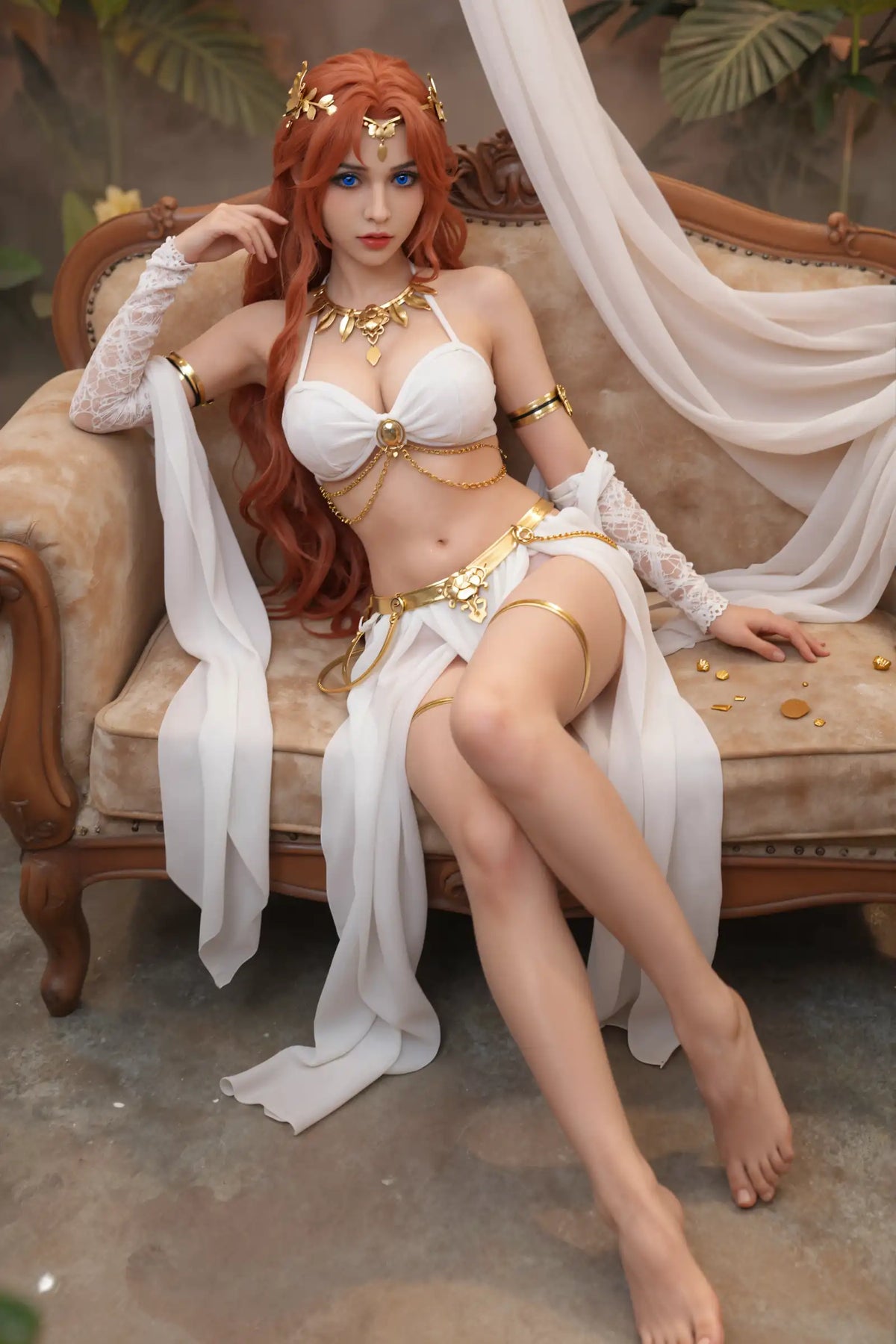 Thaleia doll seated with legs angled across the foreground and white fabric draped over the chair