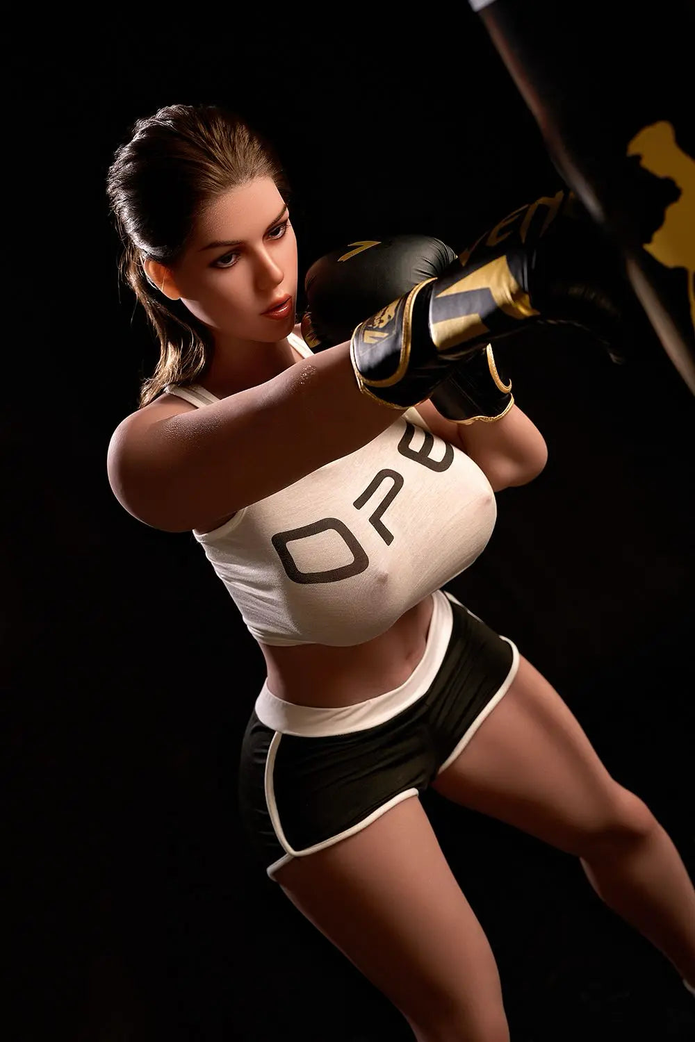 Sporty Nori big boob sex doll standing in gym with boxing gloves raised, white crop top, brunette hair, huge breasts, realistic BBW companion doll by TopLoveDoll
