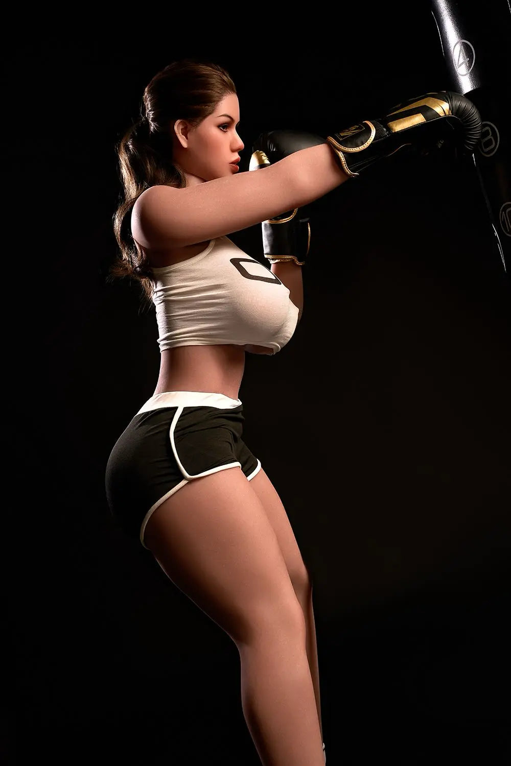Sporty Nori bbw sex doll seated in gym with boxing gloves, white crop top, brunette hair, huge breasts, customizable sex robot doll by TopLoveDoll