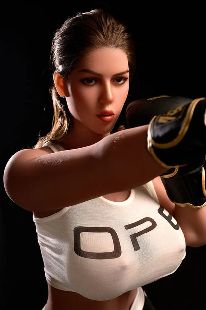 Sporty Nori bbw sex doll open-leg seated topless in gym, massive bust, brunette hair, realistic vagina detail, lifelike latina sex robot by TopLoveDoll