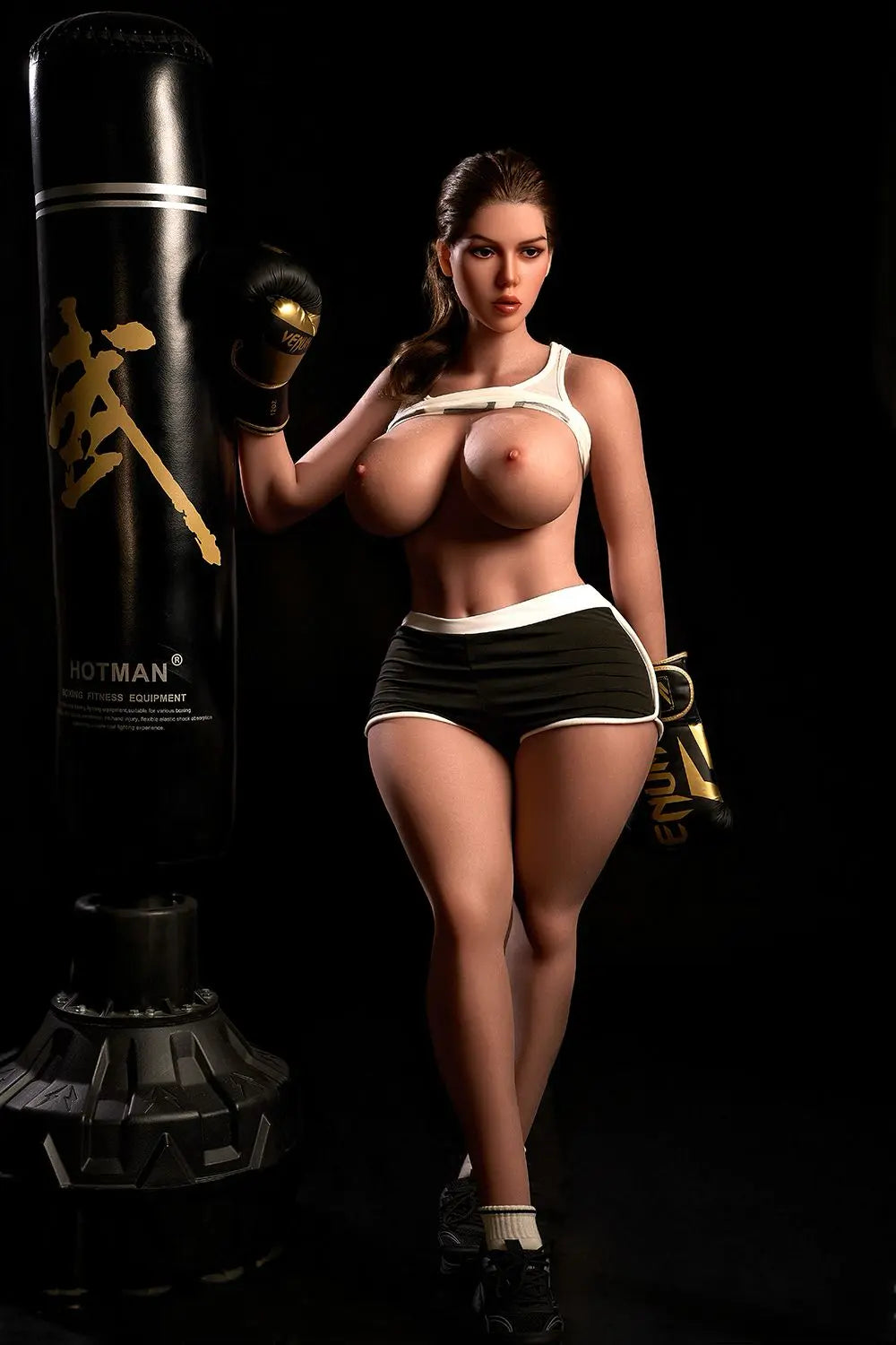 Sporty Nori latina sex doll kneeling in gym, white crop top, brunette hair, massive jiggly boobs, black shorts, lifelike BBW love doll by TopLoveDoll