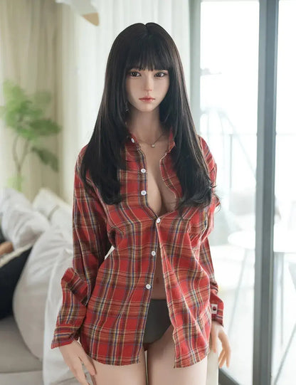 Rookie busty sex doll full body seated in red plaid shirt, black bangs, dark eyes, curvy hips, best Asian GND love doll by TopLoveDoll