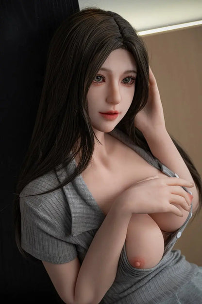 Gal beautiful love doll in a close-up portrait, with long dark hair and one hand beside her head
