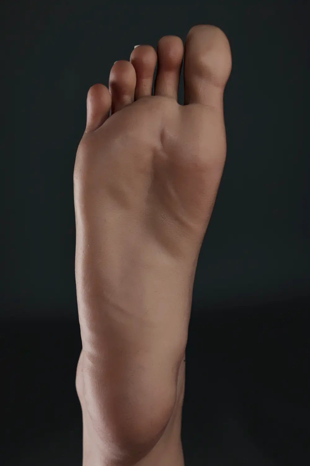 Close-up of the sole of Alina doll's bare foot, showing toes, heel and molded creases.