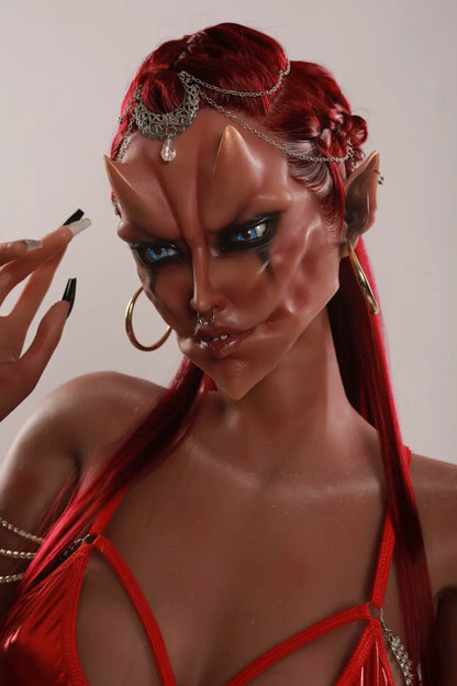 Close-up of Veyra sex doll's sculpted fantasy face with red hair, a silver headpiece and one hand beside the temple