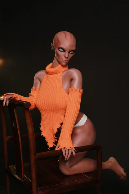 Three-quarter view of Nyxie sex doll kneeling in an orange knit top and white briefs
