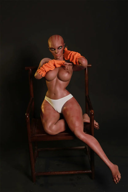 Nyxie sex doll seated on a wooden chair with one leg extended and both arms raised near the chest