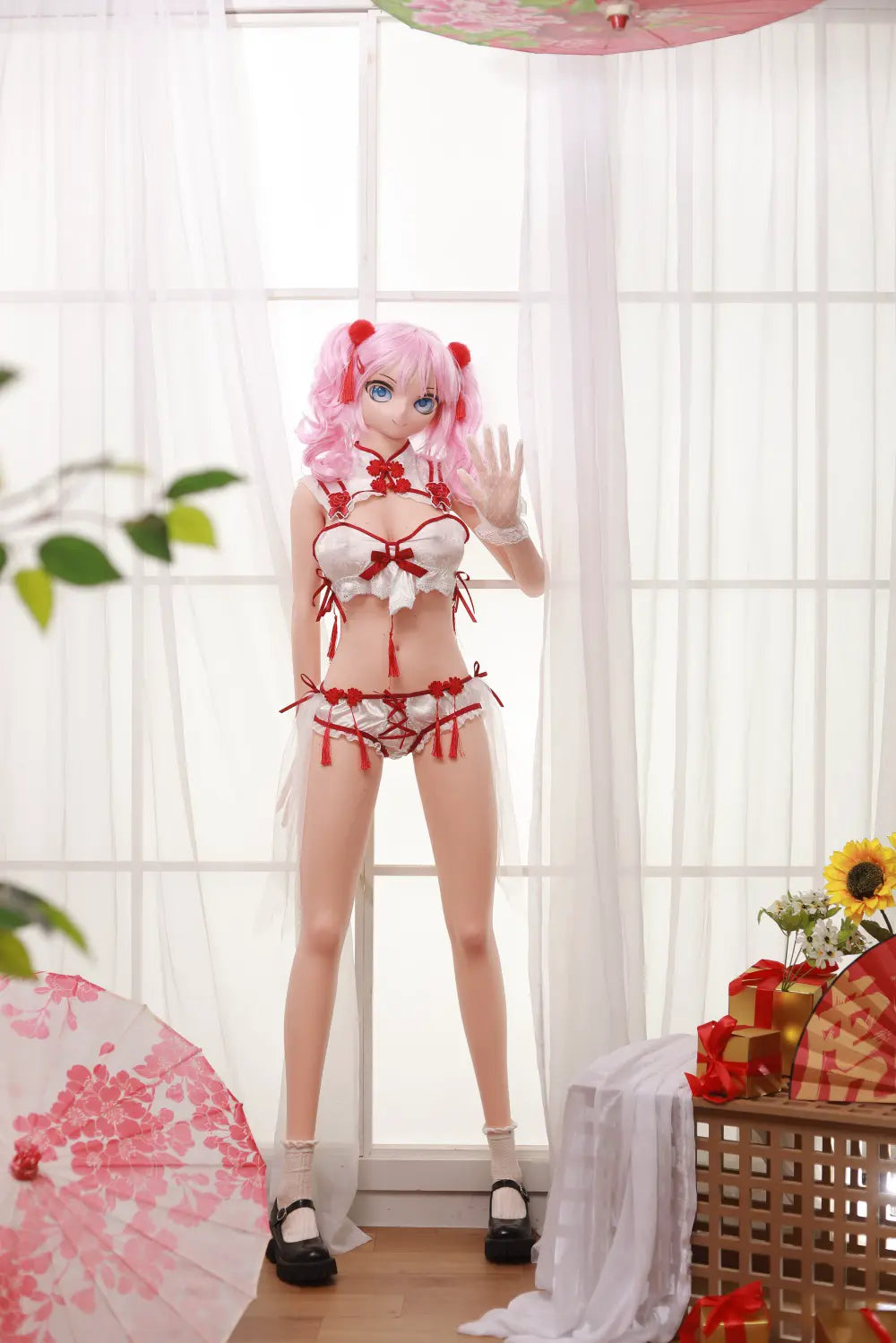 Full-length front view of Mirumi anime sex doll with pink twin tails and a red-and-white outfit in a bright room