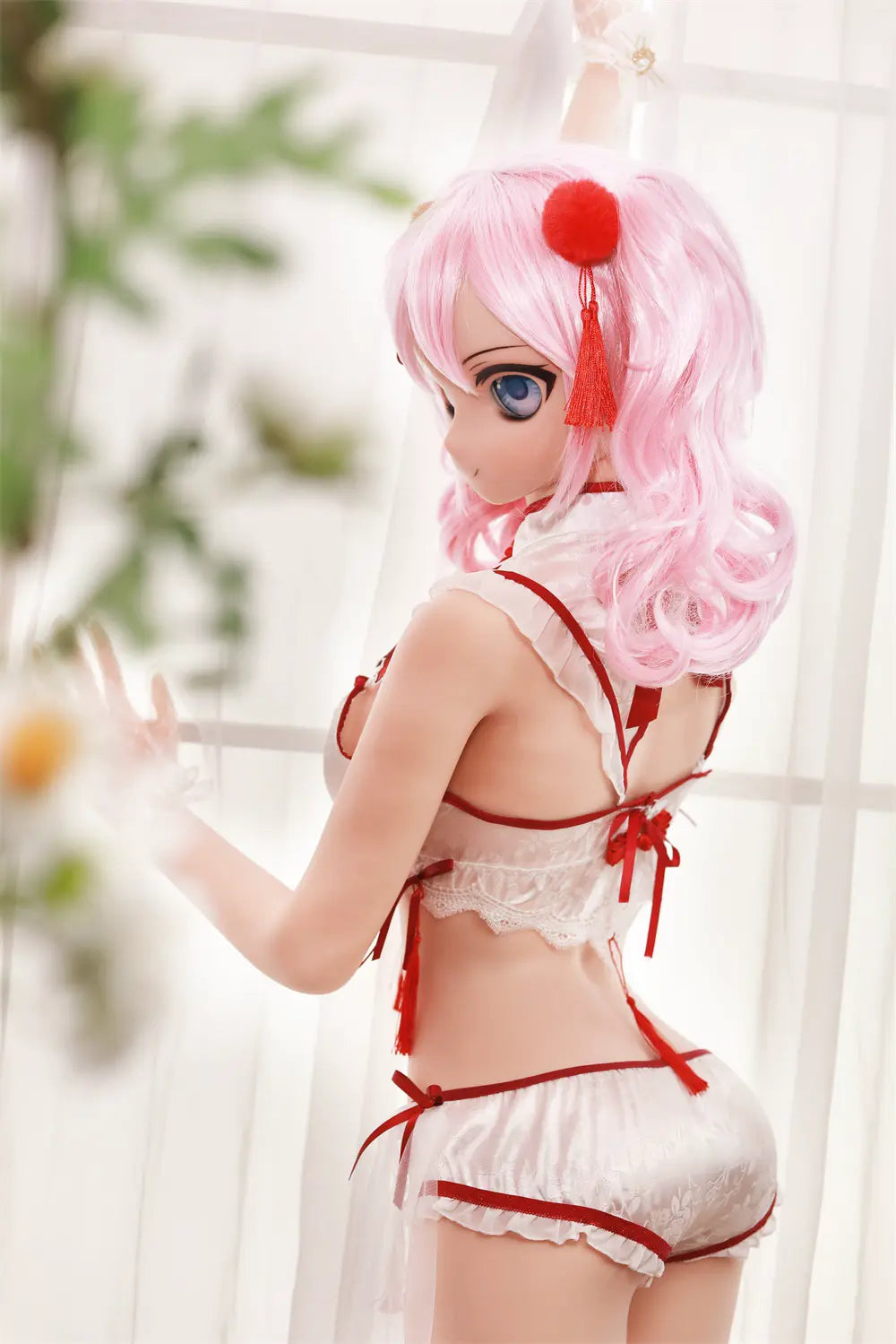 Rear three-quarter view of Mirumi sex doll looking over one shoulder