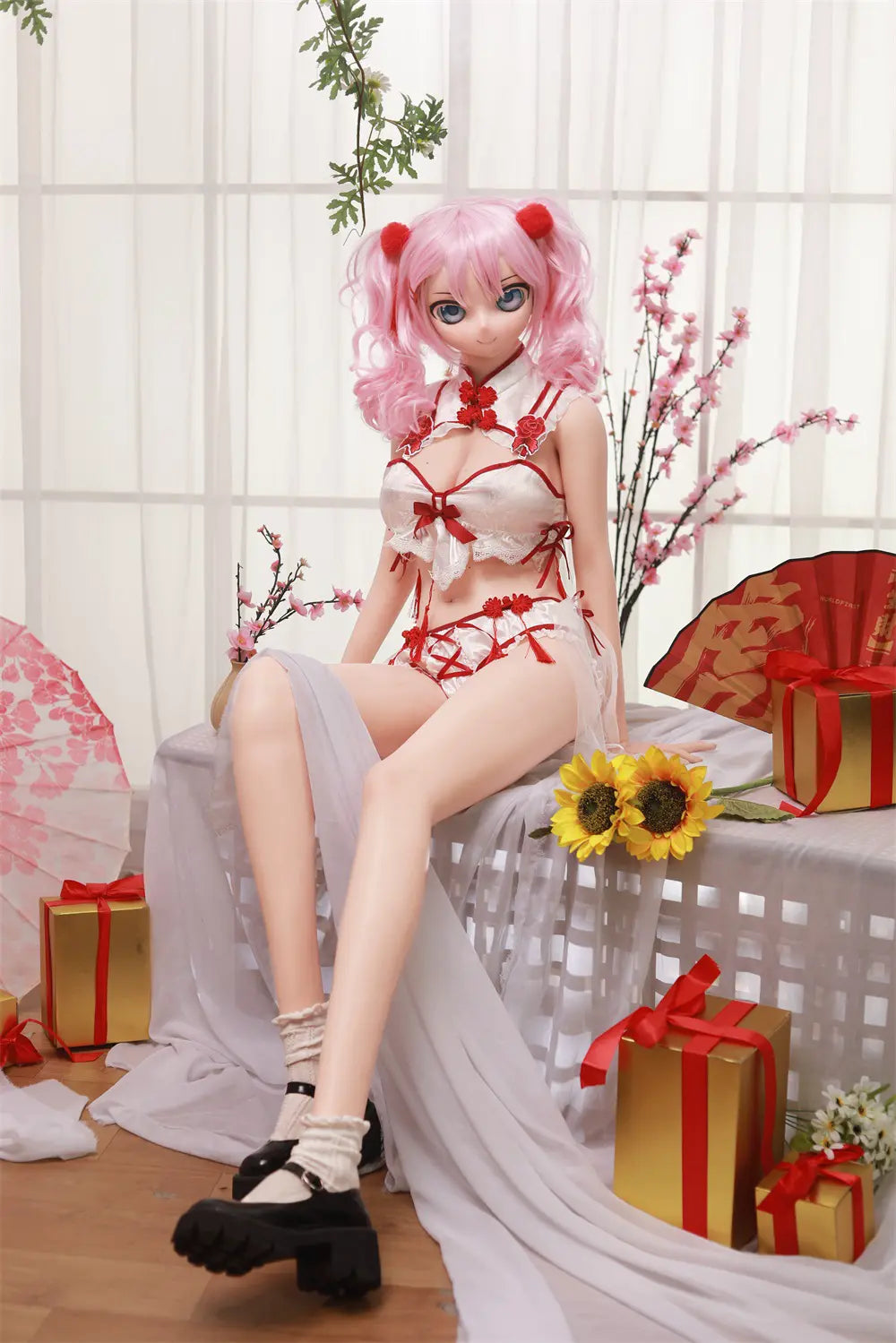 Mirumi anime sex doll seated beside flowers and decorative fans