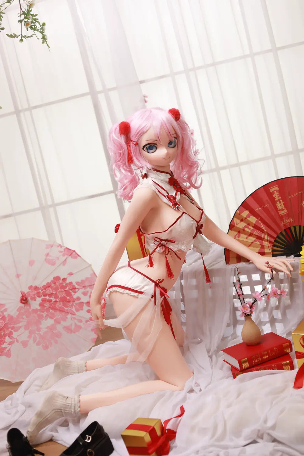 Wide seated view of Mirumi sex doll in a bright floral setting
