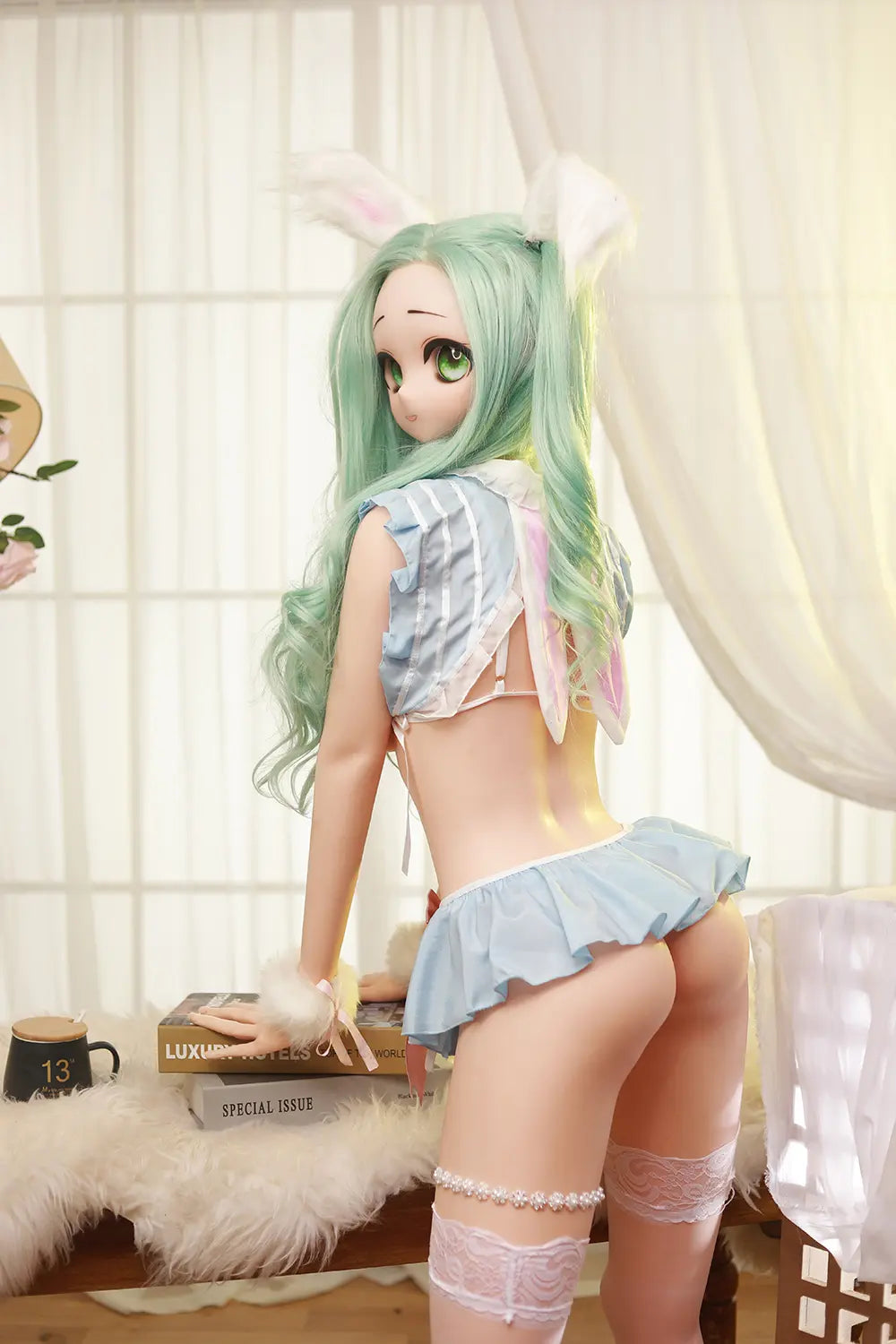 Rear three-quarter view of Mintori sex doll seated in a pastel outfit