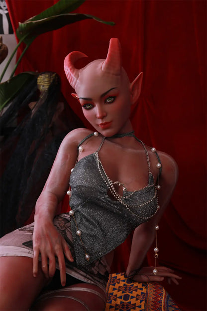 Close-up of Tauris sex doll's feet and lower legs resting on patterned fabric