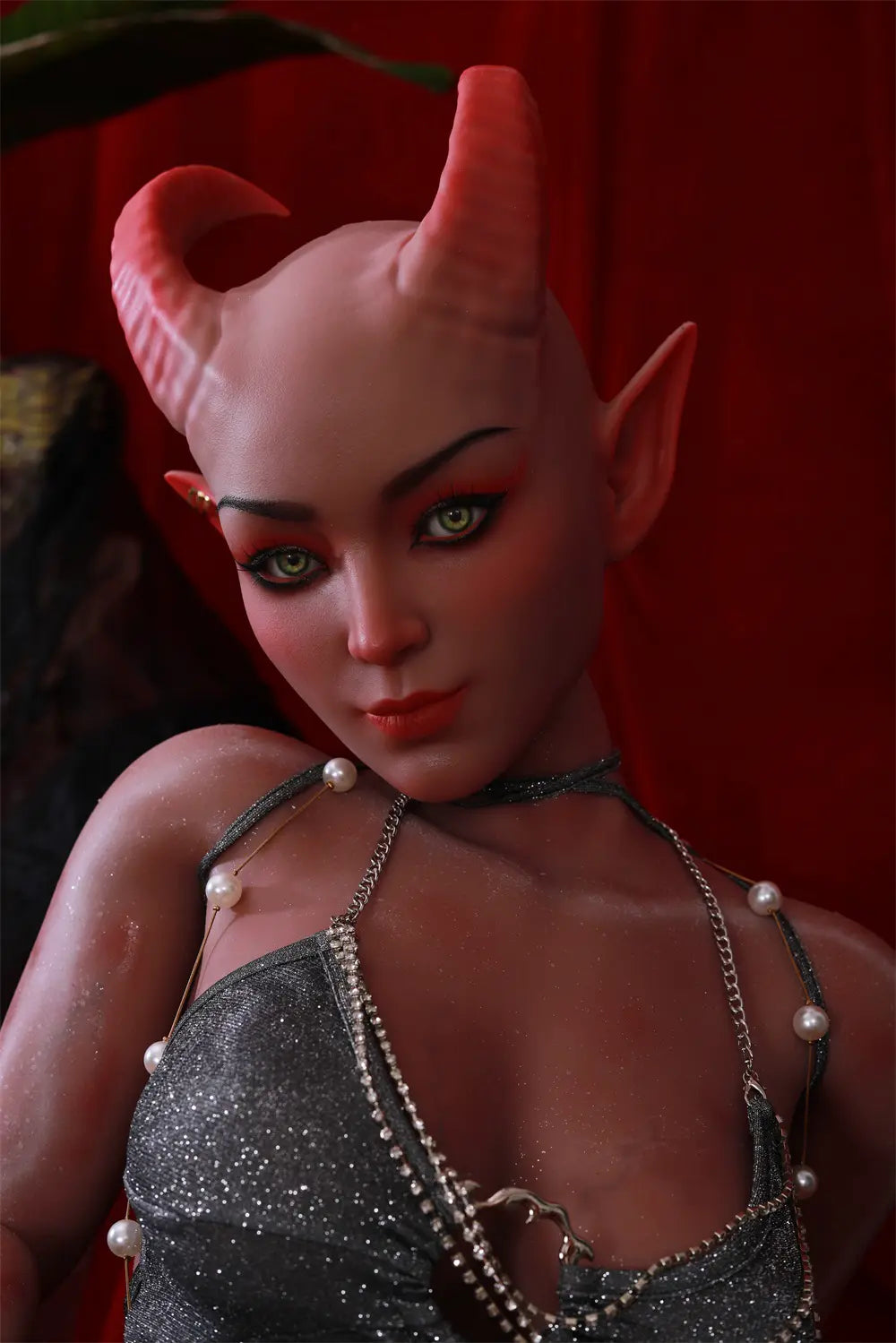 Front three-quarter view of Tauris sex doll seated with one hand resting on the platform