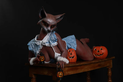 Wide front view of Vesper fox sex doll lying on a wooden table beside pumpkin lanterns