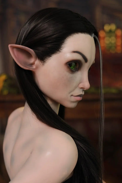 Rear view of Kaeryn sex doll showing long dark hair, black straps and blue body markings