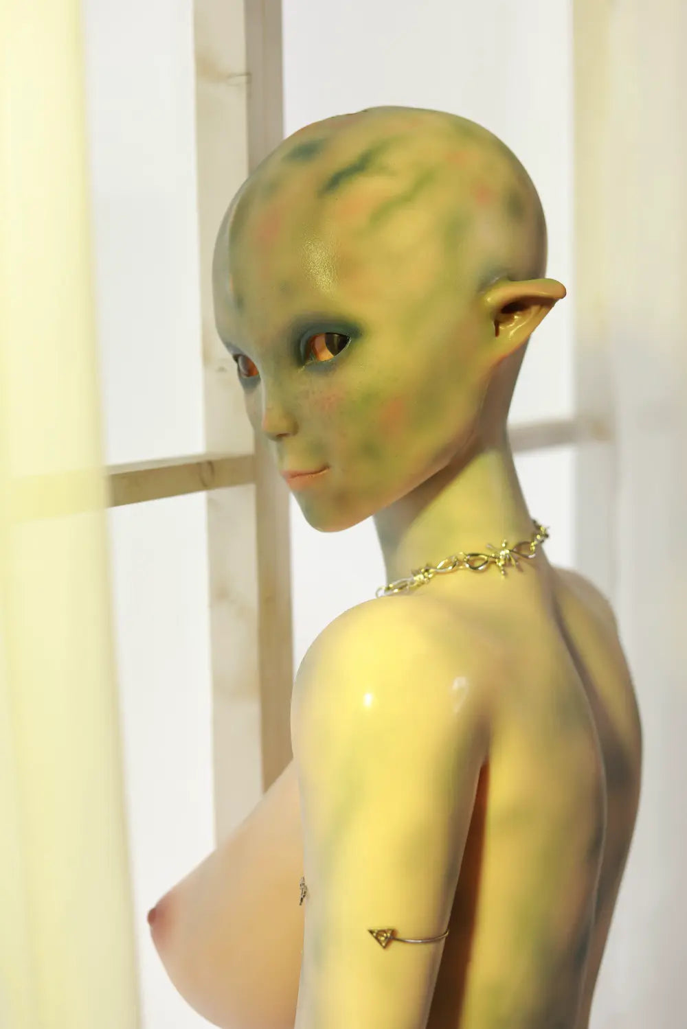 Closer rear view of Sylvara sex doll showing the back and hips