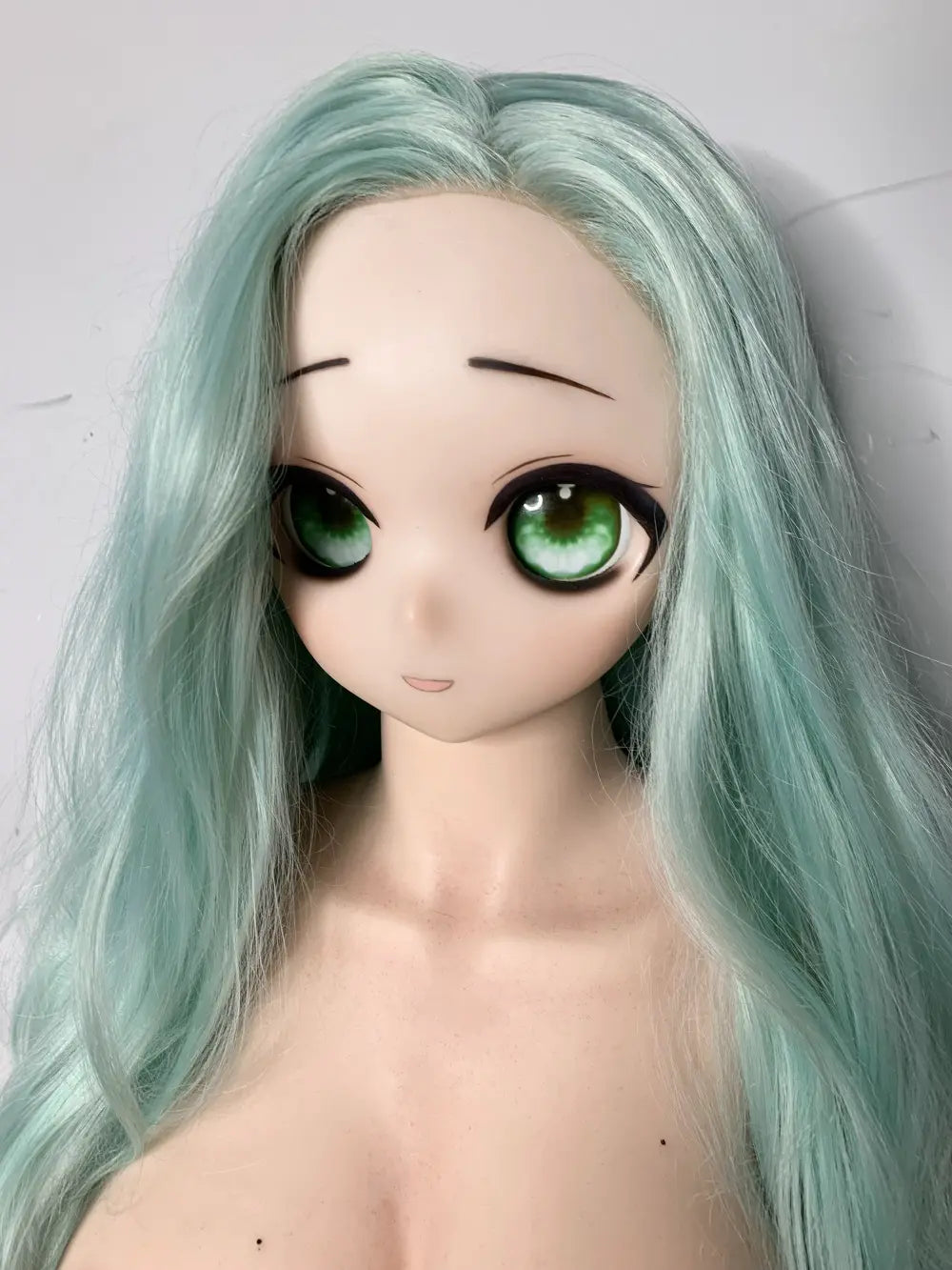 Factory close-up of Mintori's 2D-style anime face and large illustrated-looking eyes