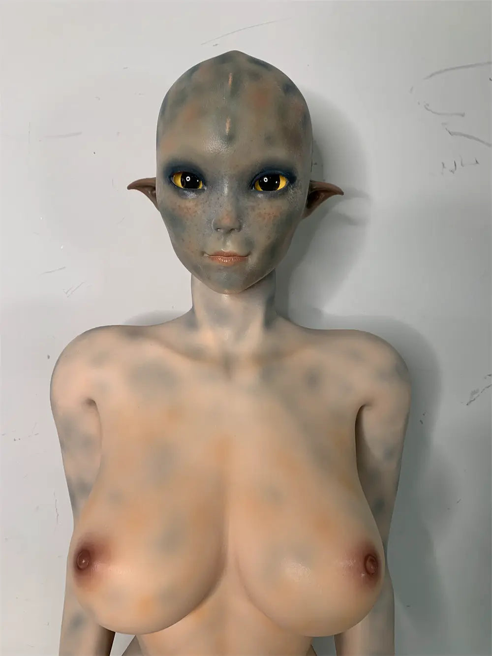 Front factory portrait of Sylvara sex doll showing the hairless fantasy head and pointed ears