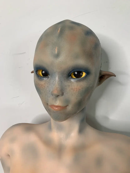 Factory close-up of Sylvara sex doll's hairless fantasy face and pointed ears