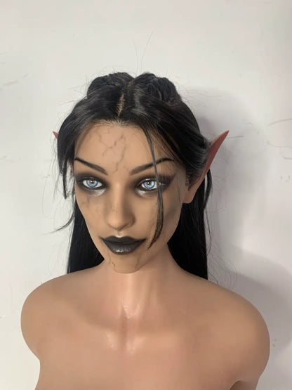 Factory close-up of Vhaera sex doll's face with pointed ears and swept-back dark hair
