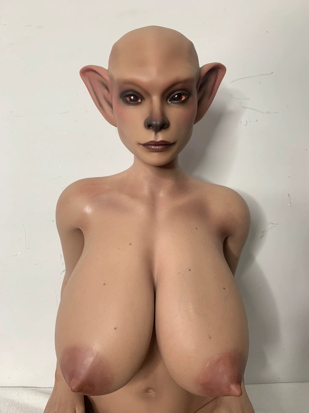 Front factory portrait of Nethrava sex doll showing the pointed ears and upper torso